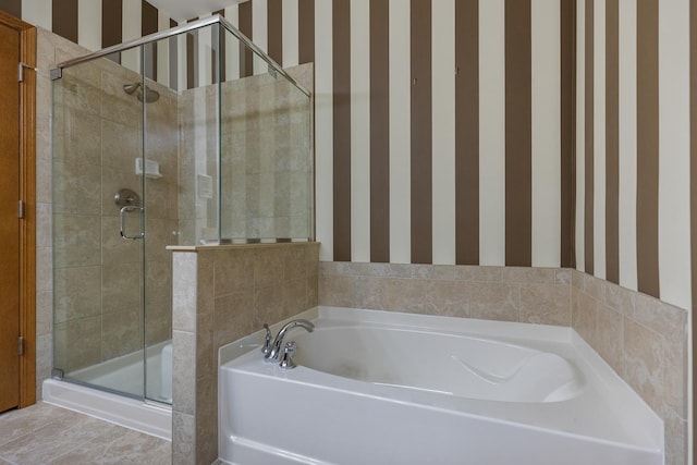full bath with a stall shower, a bath, and wallpapered walls
