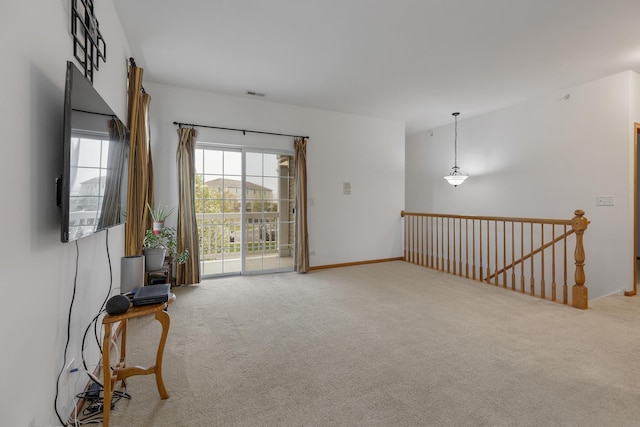 interior space with carpet, visible vents, and baseboards