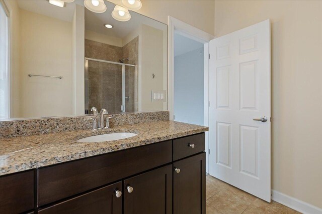 unfurnished bedroom with a walk in closet, baseboards, visible vents, and carpet flooring
