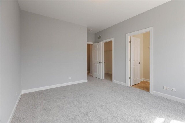 spacious closet featuring carpet flooring
