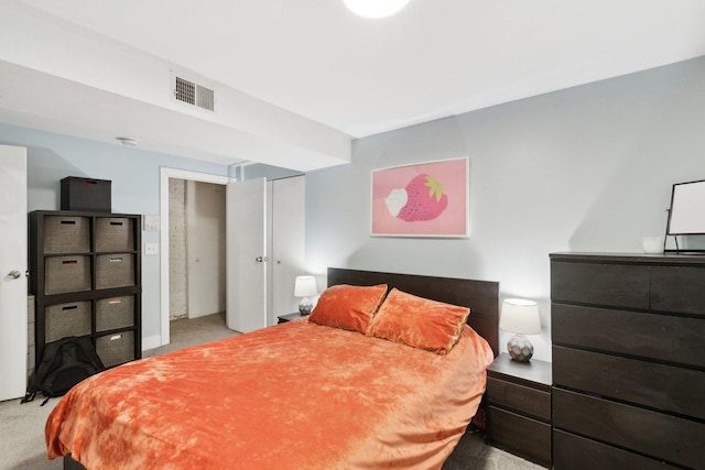 bedroom featuring light carpet and visible vents