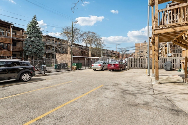 uncovered parking lot with fence
