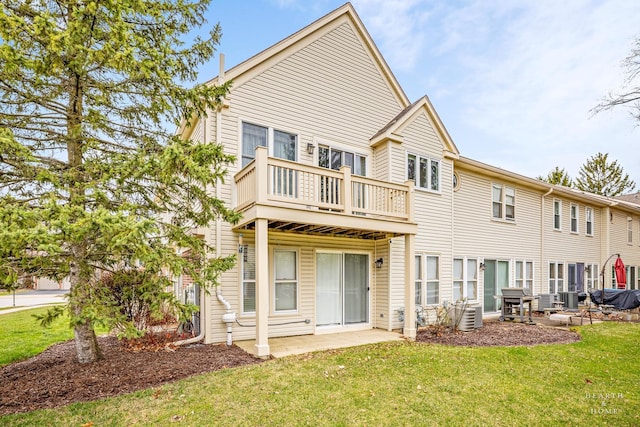back of property with a lawn