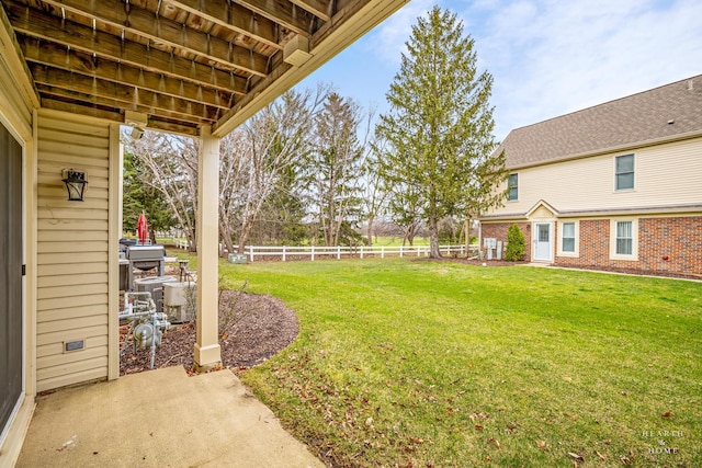 view of yard with a patio and fence