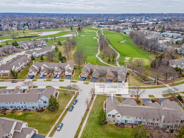 birds eye view of property featuring view of golf course, a water view, and a residential view