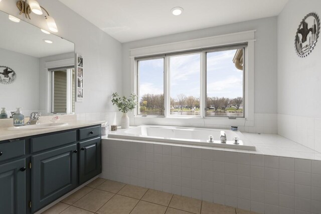 full bathroom with vanity, a garden tub, tile patterned flooring, and recessed lighting