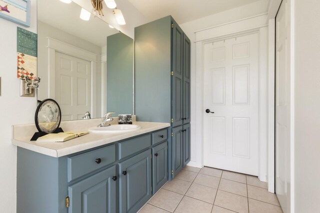 bathroom with tile patterned floors and vanity
