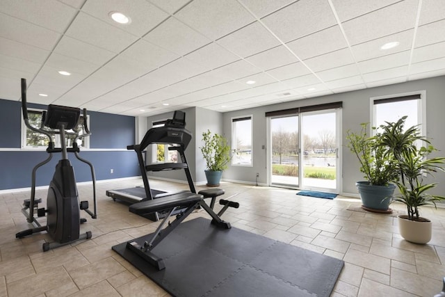 workout area with recessed lighting, a wealth of natural light, and baseboards