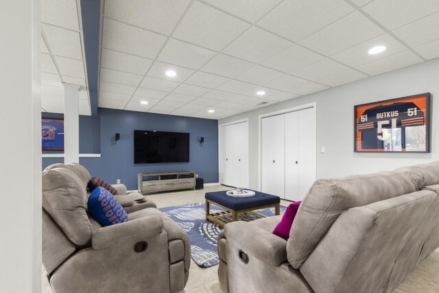 living room with recessed lighting and a drop ceiling