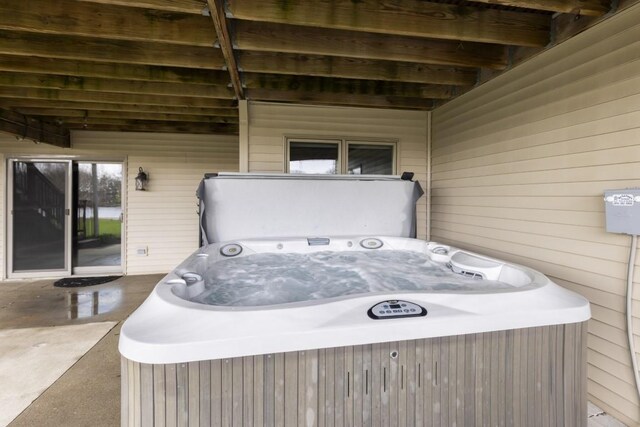exterior space featuring a hot tub