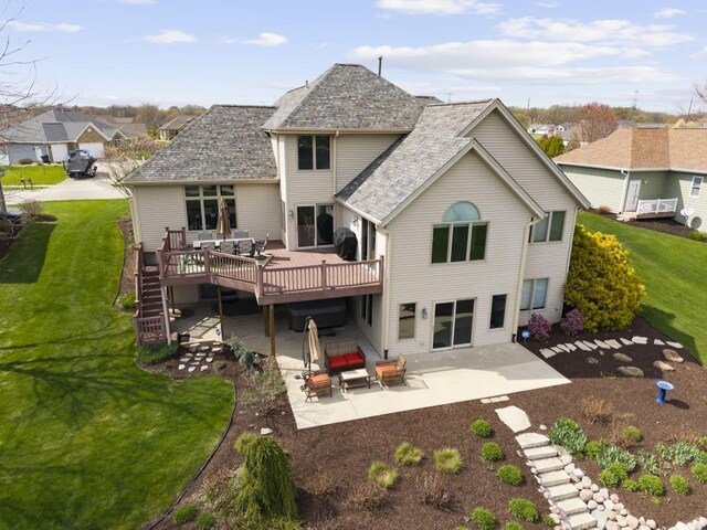 back of house with a yard, a wooden deck, a patio area, and stairs
