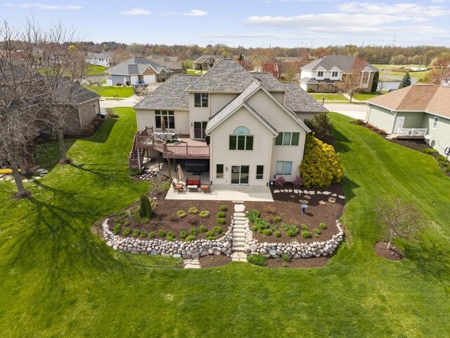 rear view of property featuring a wooden deck, a patio, a residential view, and stairs