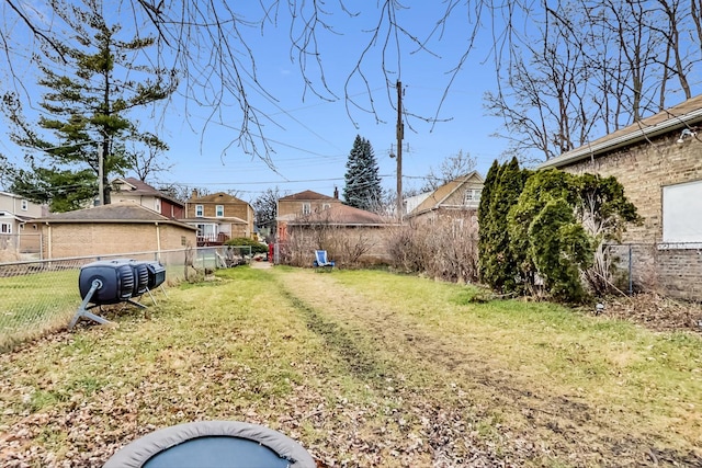 view of yard with a fenced backyard and a residential view