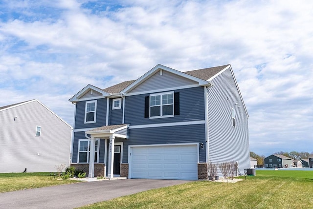 view of front of house with central air condition unit, a front lawn, aphalt driveway, a garage, and brick siding