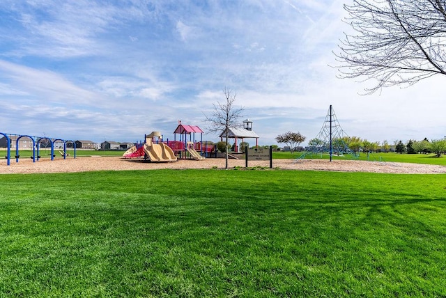 communal playground featuring a lawn