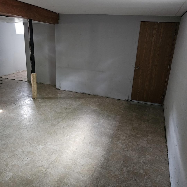 finished below grade area featuring tile patterned floors