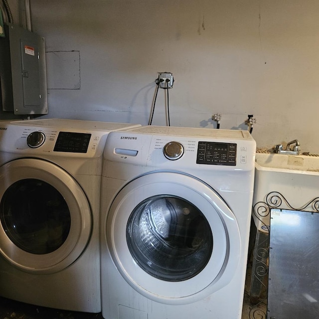 clothes washing area featuring washing machine and dryer and electric panel