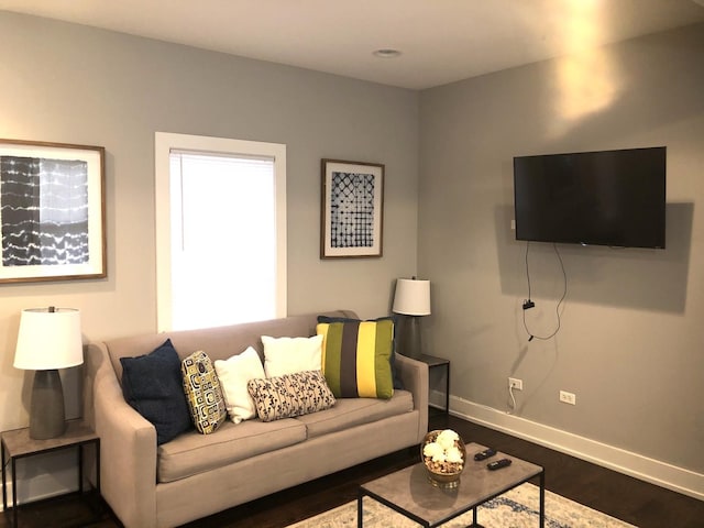 1941 W Roscoe St, Chicago, IL 60657 - living area with dark wood-type flooring and baseboards