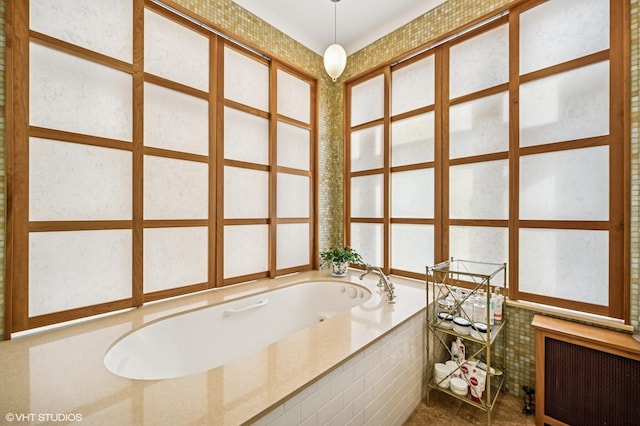 full bath featuring a garden tub and radiator heating unit