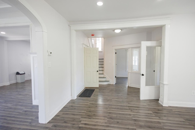 231 S Chicago Ave, Kankakee, IL 60901 - hallway featuring arched walkways, dark wood finished floors, baseboards, and recessed lighting