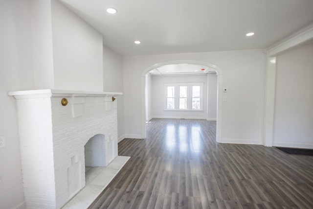231 S Chicago Ave, Kankakee, IL 60901 - unfurnished living room with recessed lighting, wood finished floors, visible vents, arched walkways, and baseboards