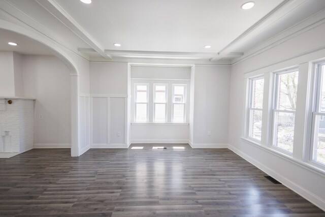 231 S Chicago Ave, Kankakee, IL 60901 - unfurnished living room with arched walkways, a healthy amount of sunlight, recessed lighting, and visible vents