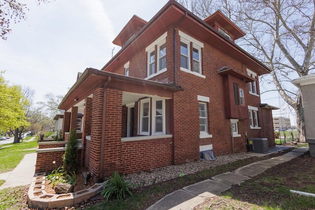 231 S Chicago Ave, Kankakee, IL 60901 - view of property exterior featuring brick siding and cooling unit