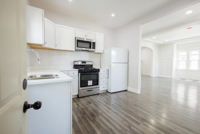 231 S Chicago Ave, Kankakee, IL 60901 - kitchen featuring a sink, appliances with stainless steel finishes, light countertops, dark wood-style flooring, and recessed lighting