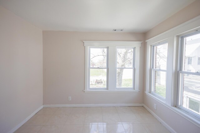 231 S Chicago Ave, Kankakee, IL 60901 - empty room with light tile patterned flooring, visible vents, and baseboards