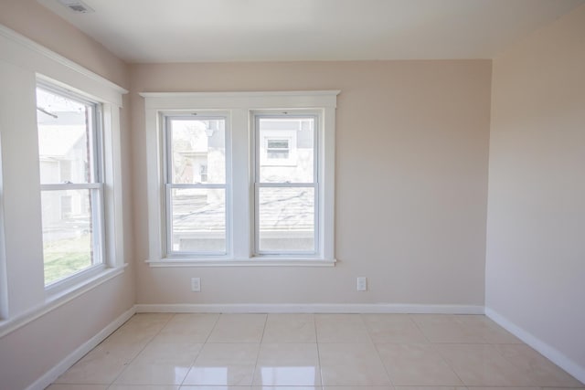 231 S Chicago Ave, Kankakee, IL 60901 - empty room featuring baseboards and light tile patterned flooring