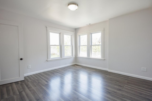 231 S Chicago Ave, Kankakee, IL 60901 - empty room featuring baseboards, dark wood-type flooring, and visible vents