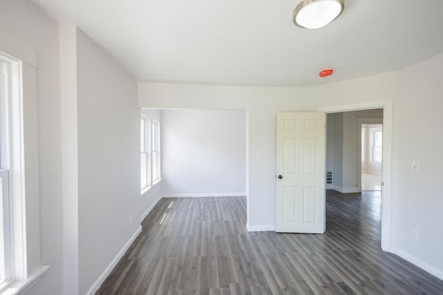 231 S Chicago Ave, Kankakee, IL 60901 - empty room with baseboards and dark wood-style flooring