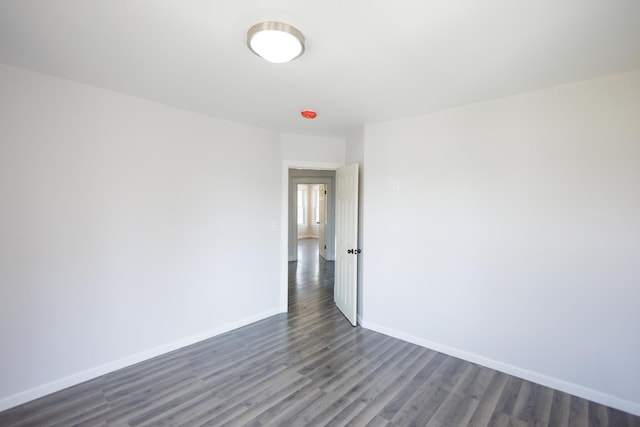 231 S Chicago Ave, Kankakee, IL 60901 - empty room featuring dark wood finished floors and baseboards
