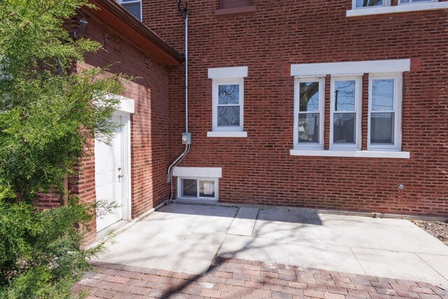 231 S Chicago Ave, Kankakee, IL 60901 - exterior space featuring a patio area and brick siding