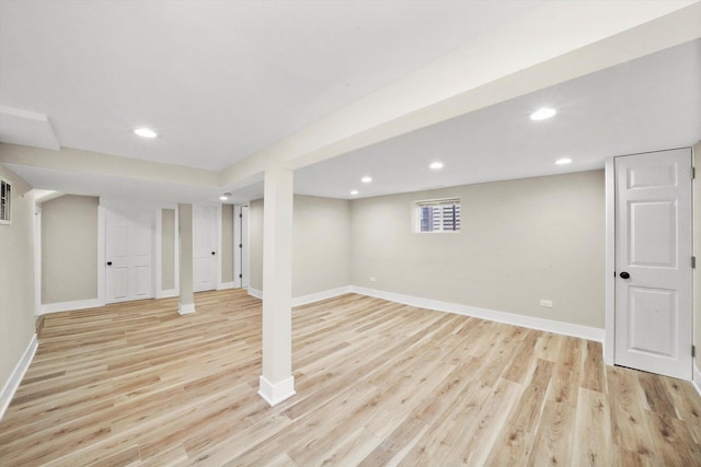 basement featuring recessed lighting, baseboards, and light wood finished floors