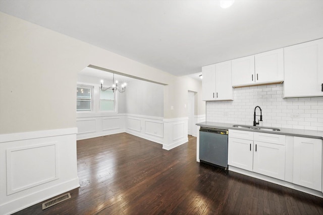kitchen with visible vents, dishwasher, a sink, a chandelier, and white cabinetry