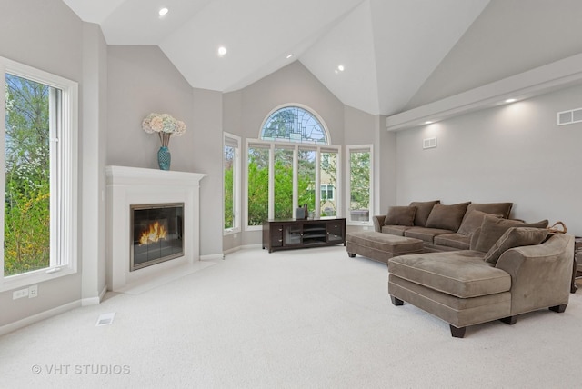 2407 Shaker Ct, Naperville, IL 60564 - carpeted living area featuring a fireplace with flush hearth, high vaulted ceiling, baseboards, and recessed lighting