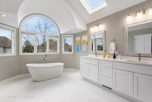 2407 Shaker Ct, Naperville, IL 60564 - full bathroom with vaulted ceiling with skylight, a soaking tub, a sink, and visible vents