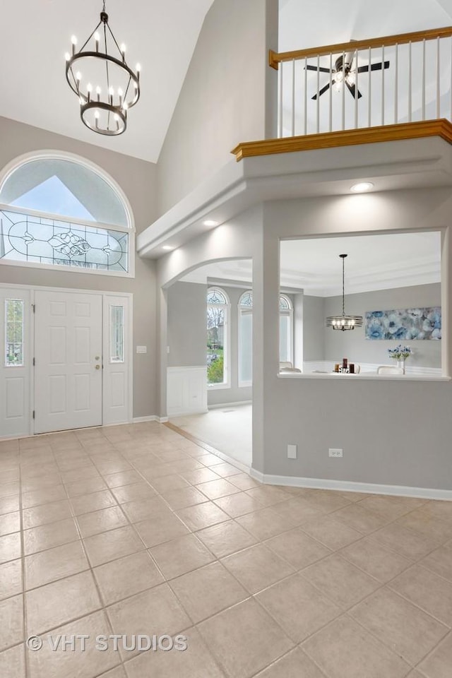 2407 Shaker Ct, Naperville, IL 60564 - entrance foyer with high vaulted ceiling, a wealth of natural light, a notable chandelier, and light tile patterned floors