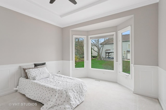 2407 Shaker Ct, Naperville, IL 60564 - carpeted bedroom with visible vents, a wainscoted wall, a ceiling fan, and multiple windows