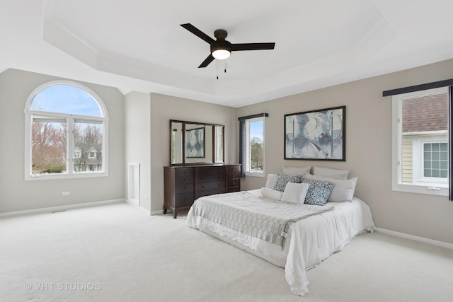 2407 Shaker Ct, Naperville, IL 60564 - carpeted bedroom with a tray ceiling, crown molding, baseboards, and a ceiling fan