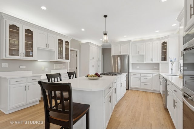 2407 Shaker Ct, Naperville, IL 60564 - kitchen with light wood-type flooring, white cabinetry, open shelves, a kitchen island, and appliances with stainless steel finishes