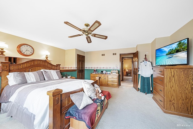 bedroom with ceiling fan, light colored carpet, and visible vents
