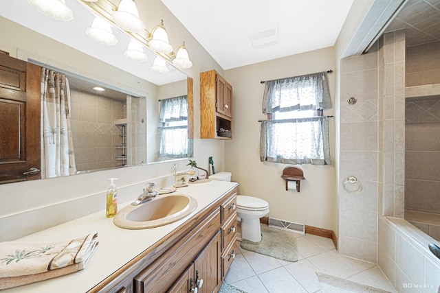 bathroom featuring tile patterned floors, plenty of natural light, tiled shower, and visible vents
