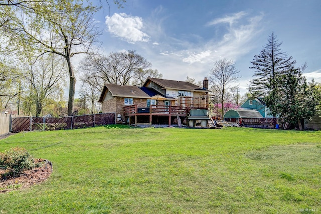 view of yard with a fenced backyard and a wooden deck