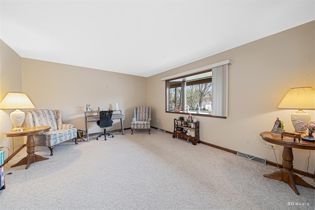living area with carpet floors, baseboards, and visible vents