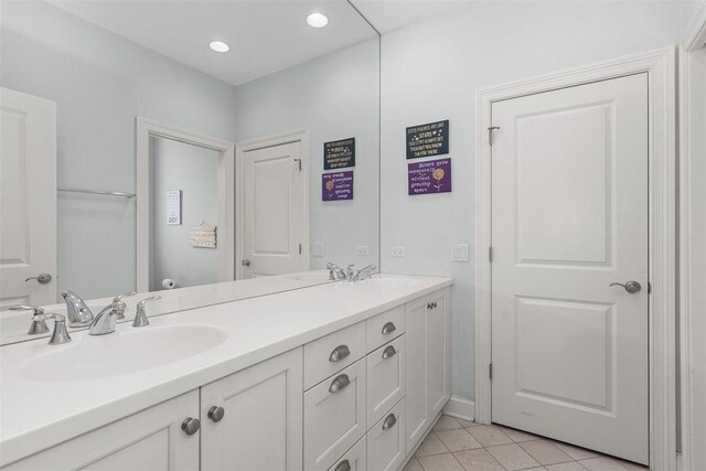 1784 Reserve Ct, Highland Park, IL 60035 - full bath with tile patterned flooring, double vanity, and recessed lighting