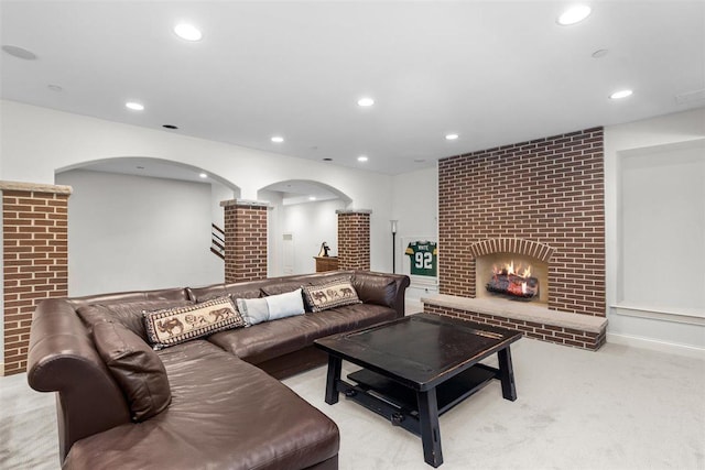 1784 Reserve Ct, Highland Park, IL 60035 - living room with carpet flooring, recessed lighting, arched walkways, and a brick fireplace