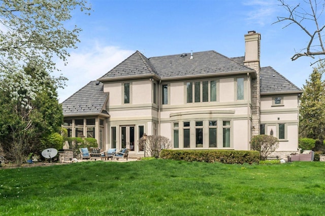 1784 Reserve Ct, Highland Park, IL 60035 - rear view of property with a high end roof, a yard, and stucco siding