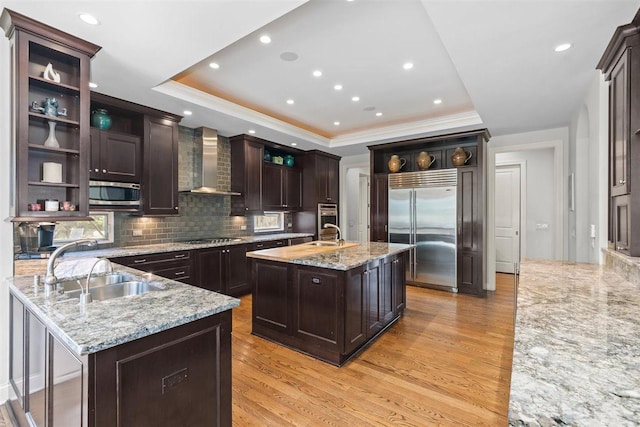 1784 Reserve Ct, Highland Park, IL 60035 - kitchen featuring appliances with stainless steel finishes, open shelves, wall chimney exhaust hood, a raised ceiling, and crown molding